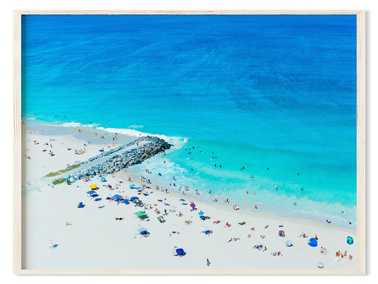 Aerial Art Print of a crowd City Beach with loots of people with umbrellas.